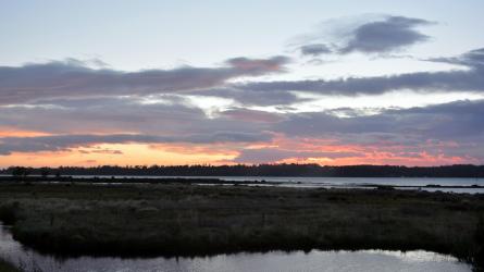 Sun setting over the water