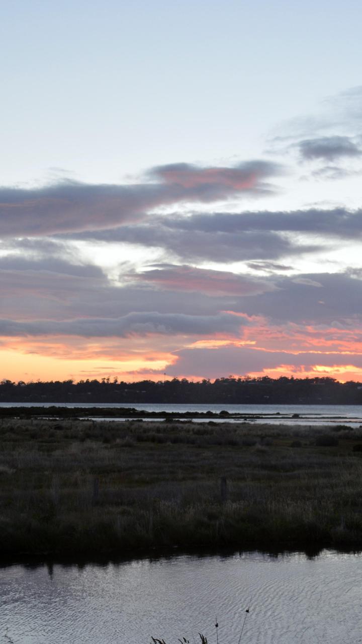 Sun setting over the water