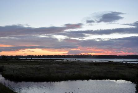 Sun setting over the water